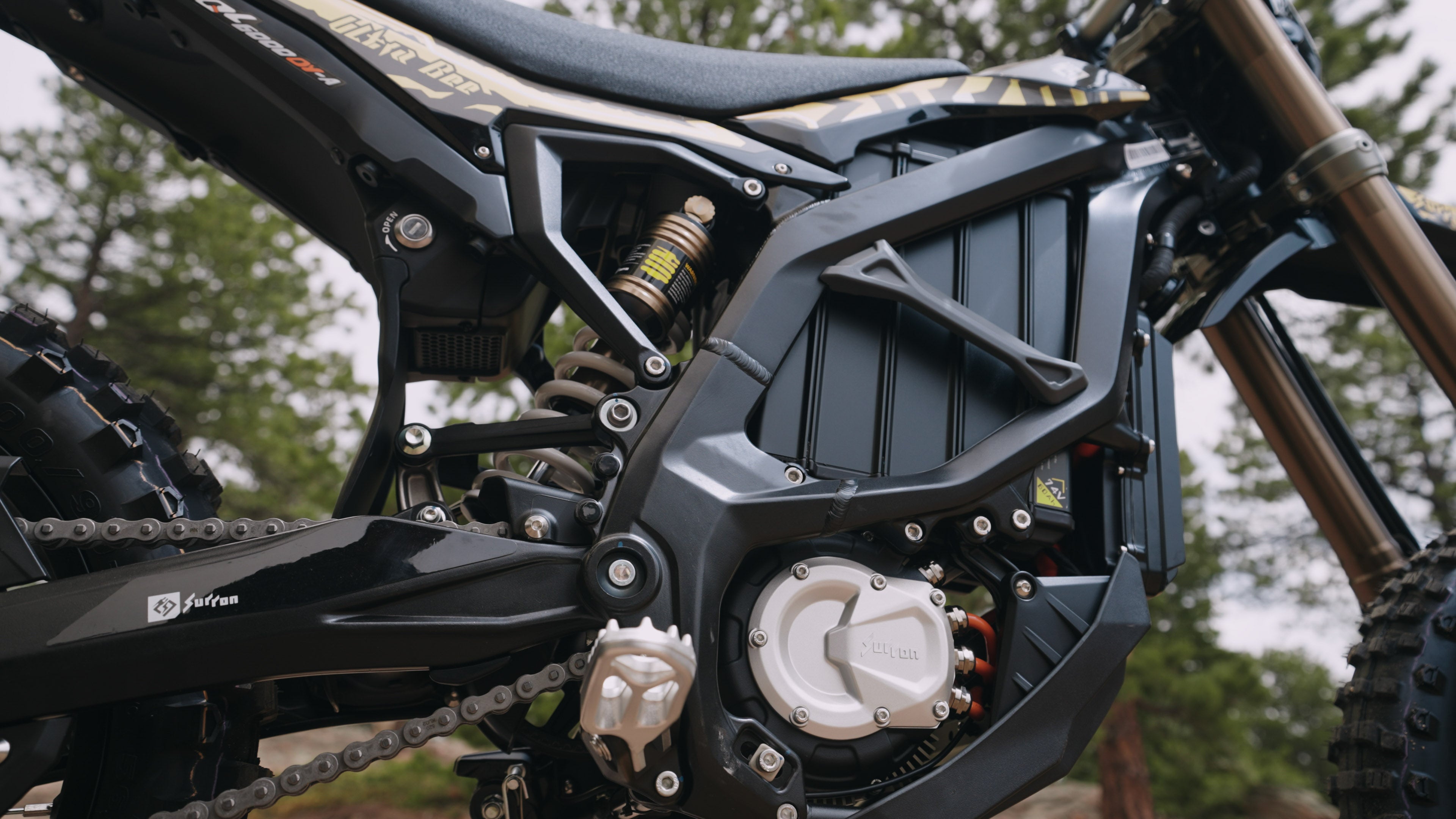 A Closeup of 2025 Surron Ultra Bee Battery and motor